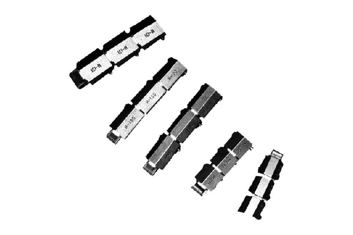 Multiple heavy industrial chain samples on a white background
